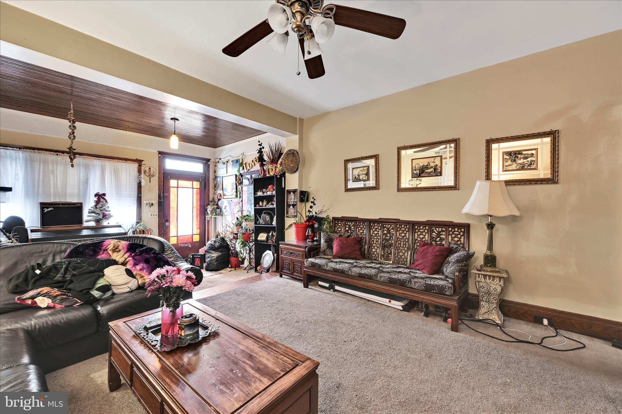 544 Spruce Street Steelton, PA 17113 - Photo 13 of 33 a living room with furniture gym equipment and a window