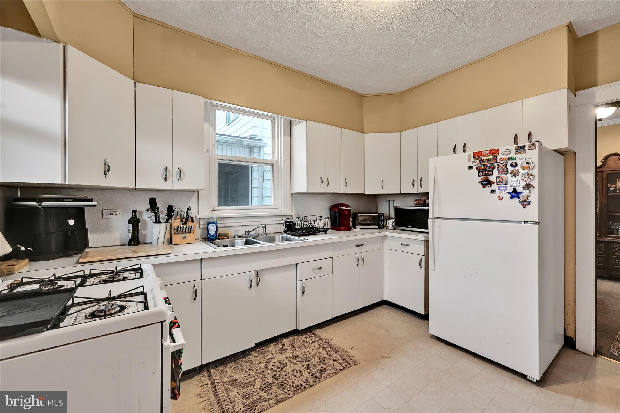 544 Spruce Street Steelton, PA 17113 - Photo 17 of 33 a kitchen with white cabinets and white appliances