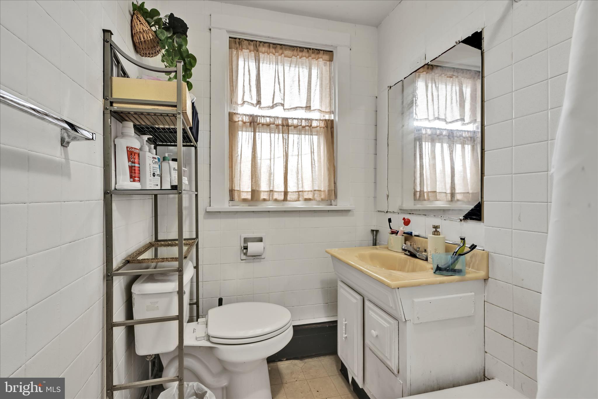 544 Spruce Street Steelton, PA 17113 - Photo 21 of 33 a bathroom with a sink a toilet and a window