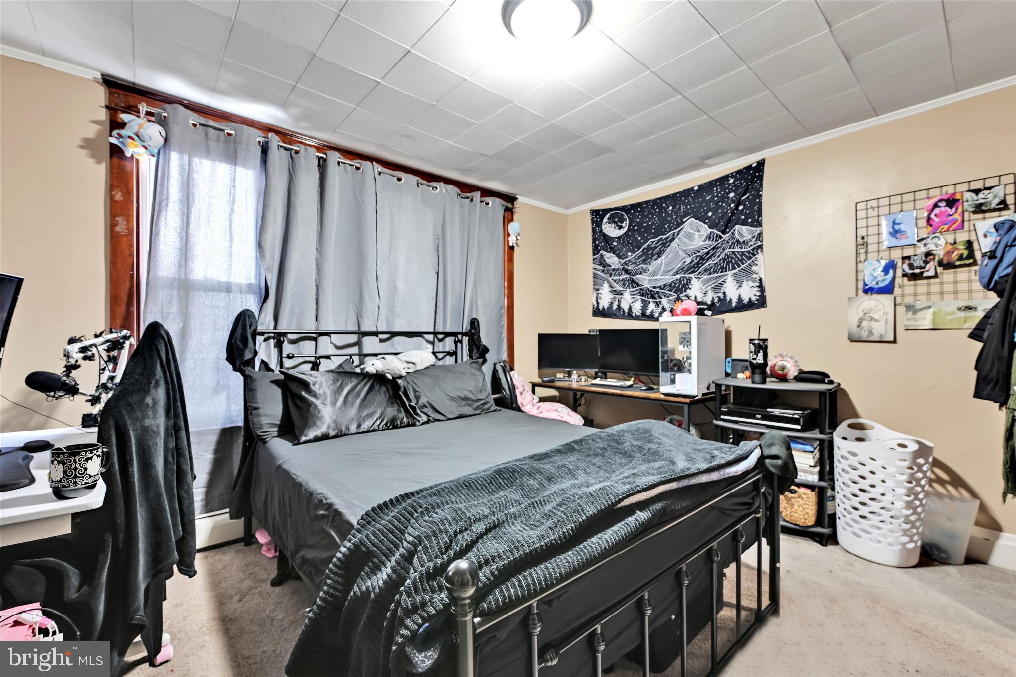 544 Spruce Street Steelton, PA 17113 - Photo 26 of 33 a bedroom with a bed and a flat screen tv