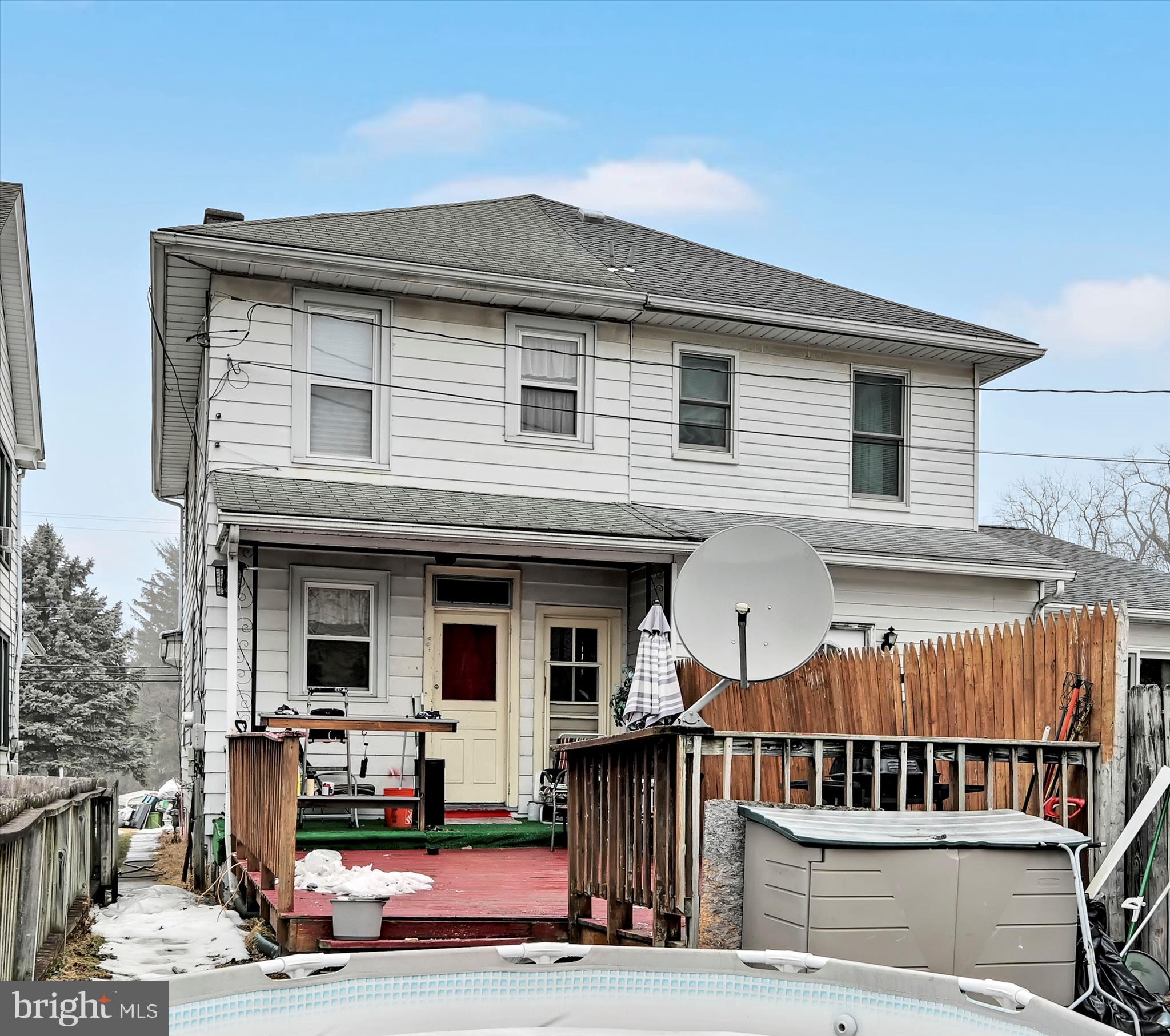544 Spruce Street Steelton, PA 17113 - Photo 32 of 33 a view of a house with large windows and a table
