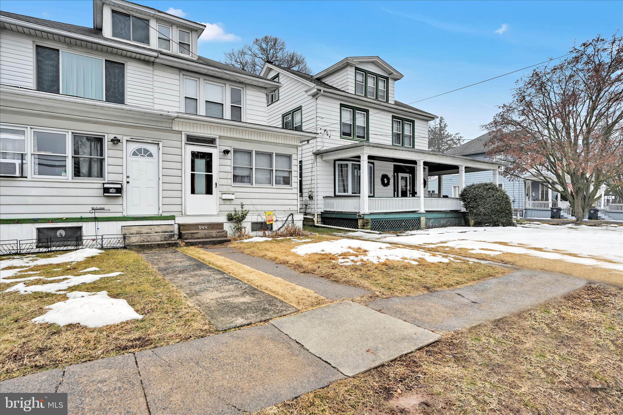 544 Spruce Street Steelton, PA 17113 - Photo 4 of 33 a view of a white house with a large tree