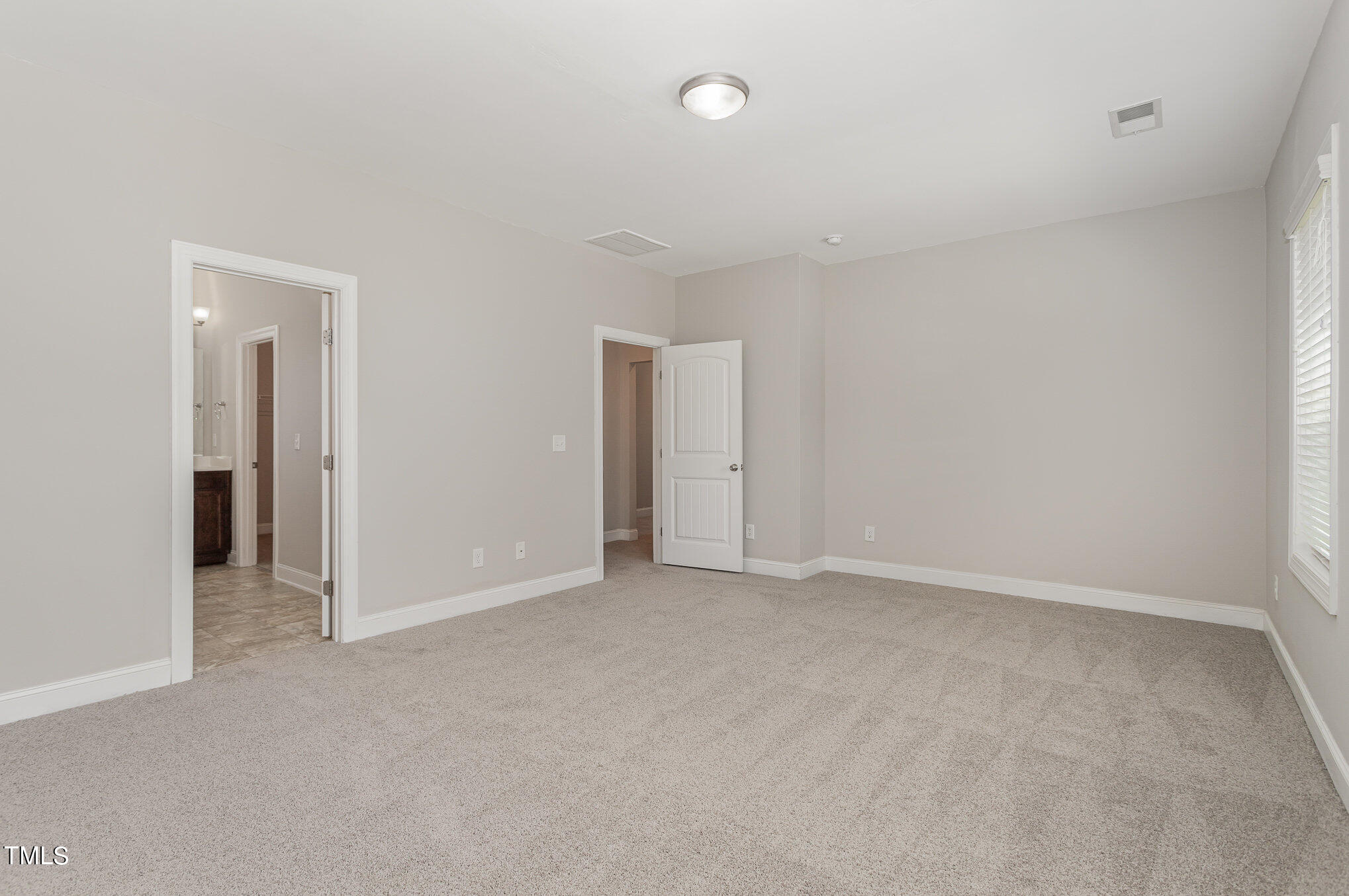 1021 Silver Farm Road Raleigh, NC 27603 - Photo 19 of 42 an empty room with an entryway