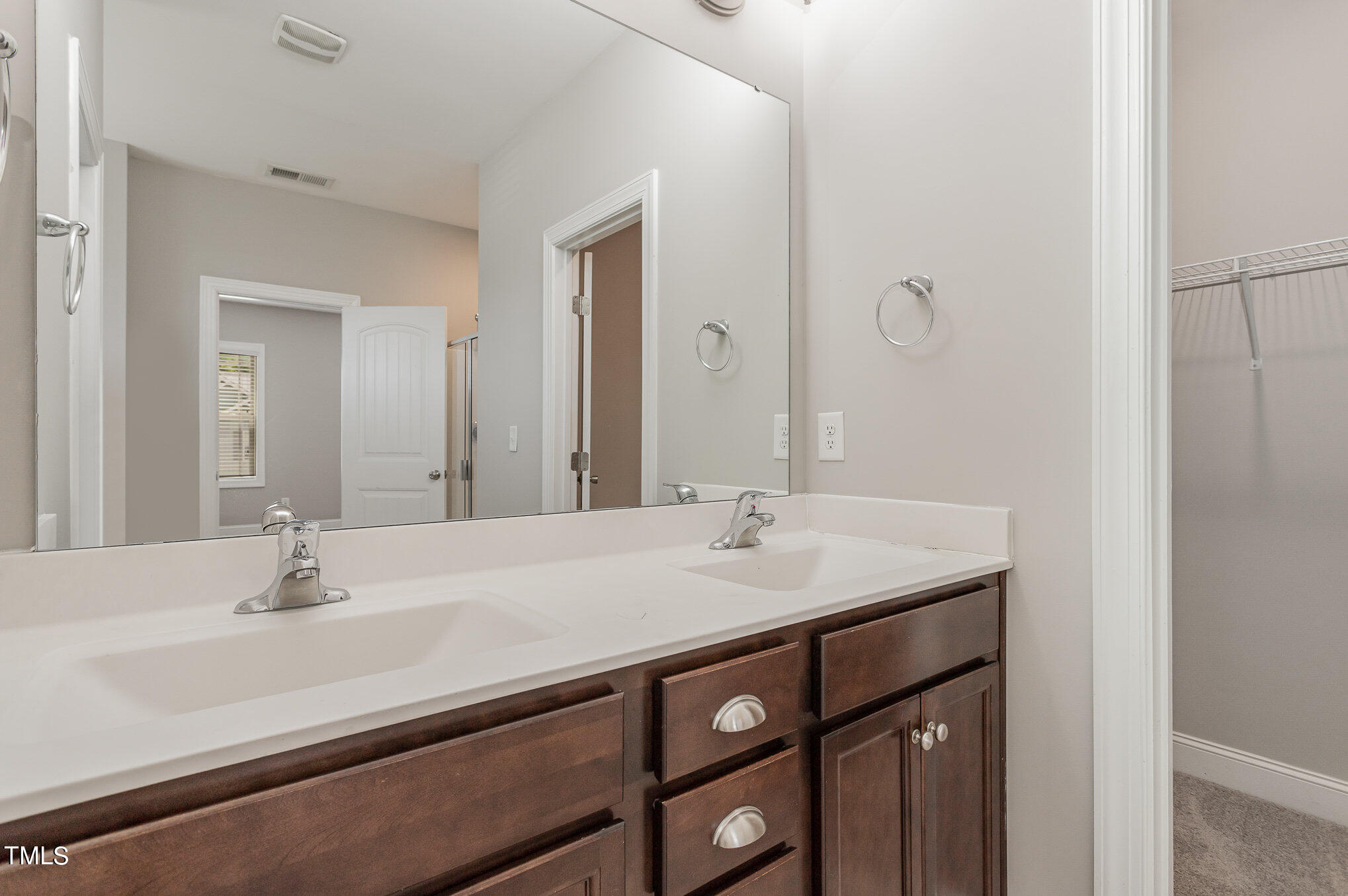 1021 Silver Farm Road Raleigh, NC 27603 - Photo 30 of 42 a bathroom with a sink and a mirror