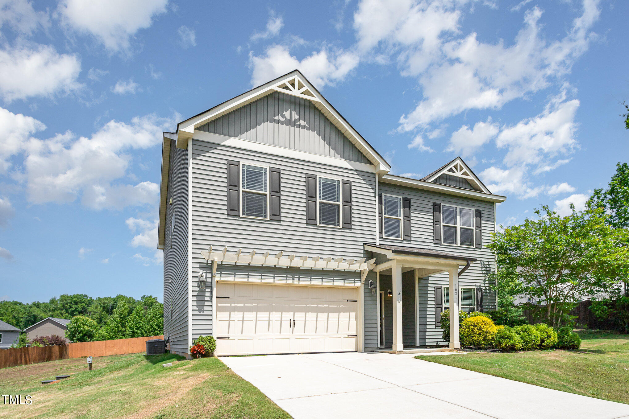 1021 Silver Farm Road Raleigh, NC 27603 - Photo 3 of 42 a front view of a house with garden