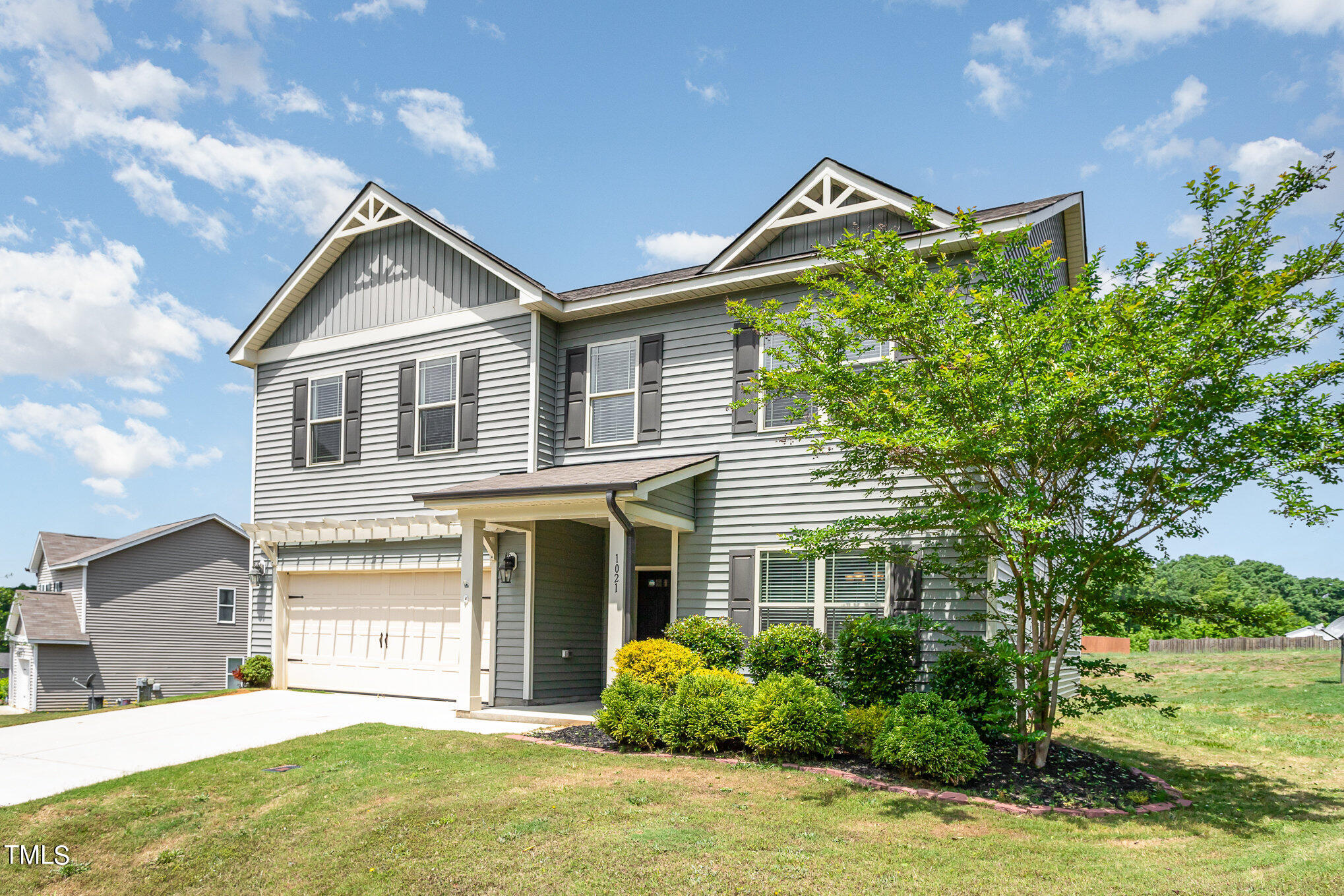 1021 Silver Farm Road Raleigh, NC 27603 - Photo 4 of 42 a front view of a house with garden