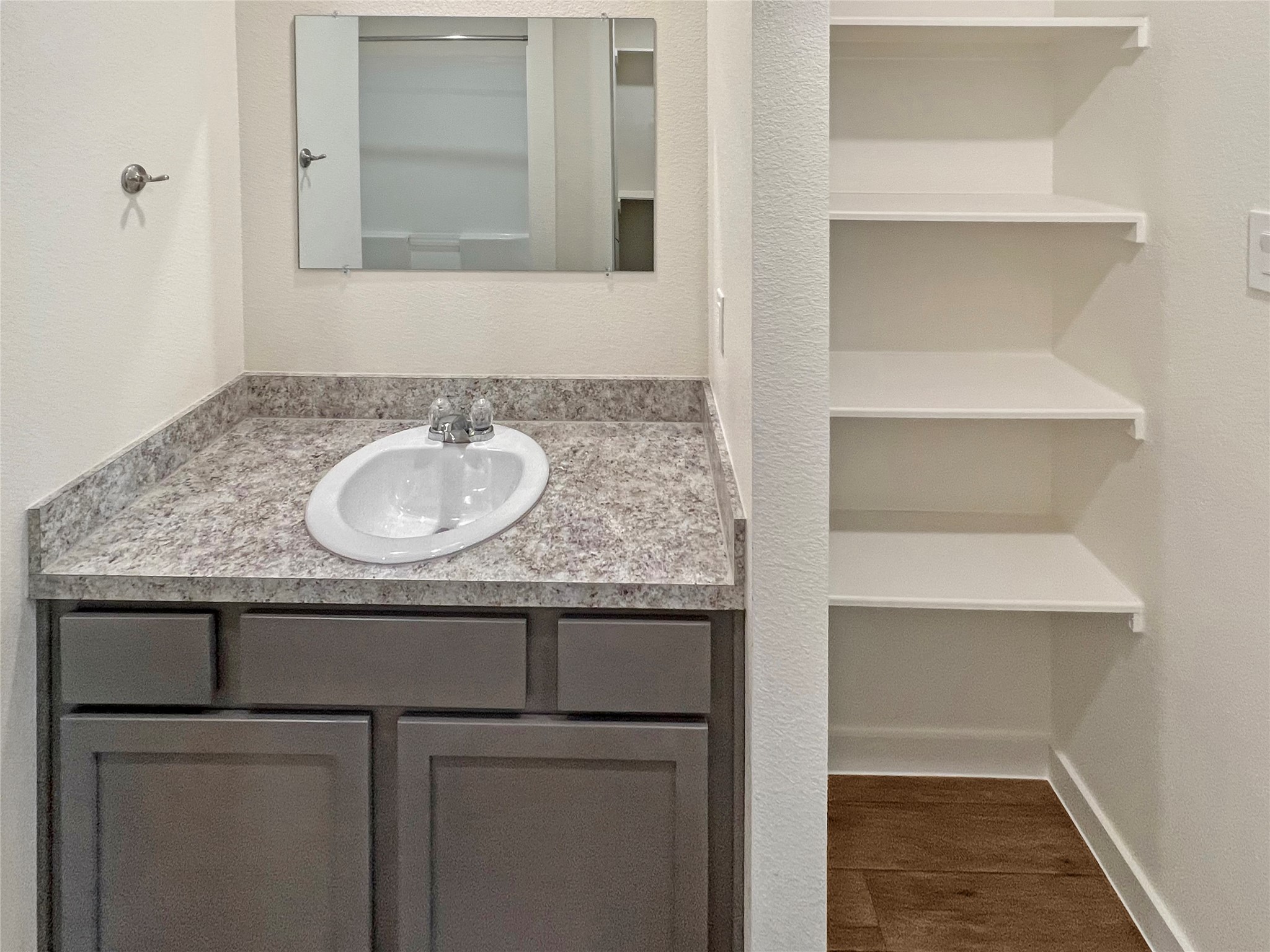 12603 Telge Road, Unit 8EH Cypress, TX 77429 - Photo 16 of 32 a bathroom with a sink and a mirror
