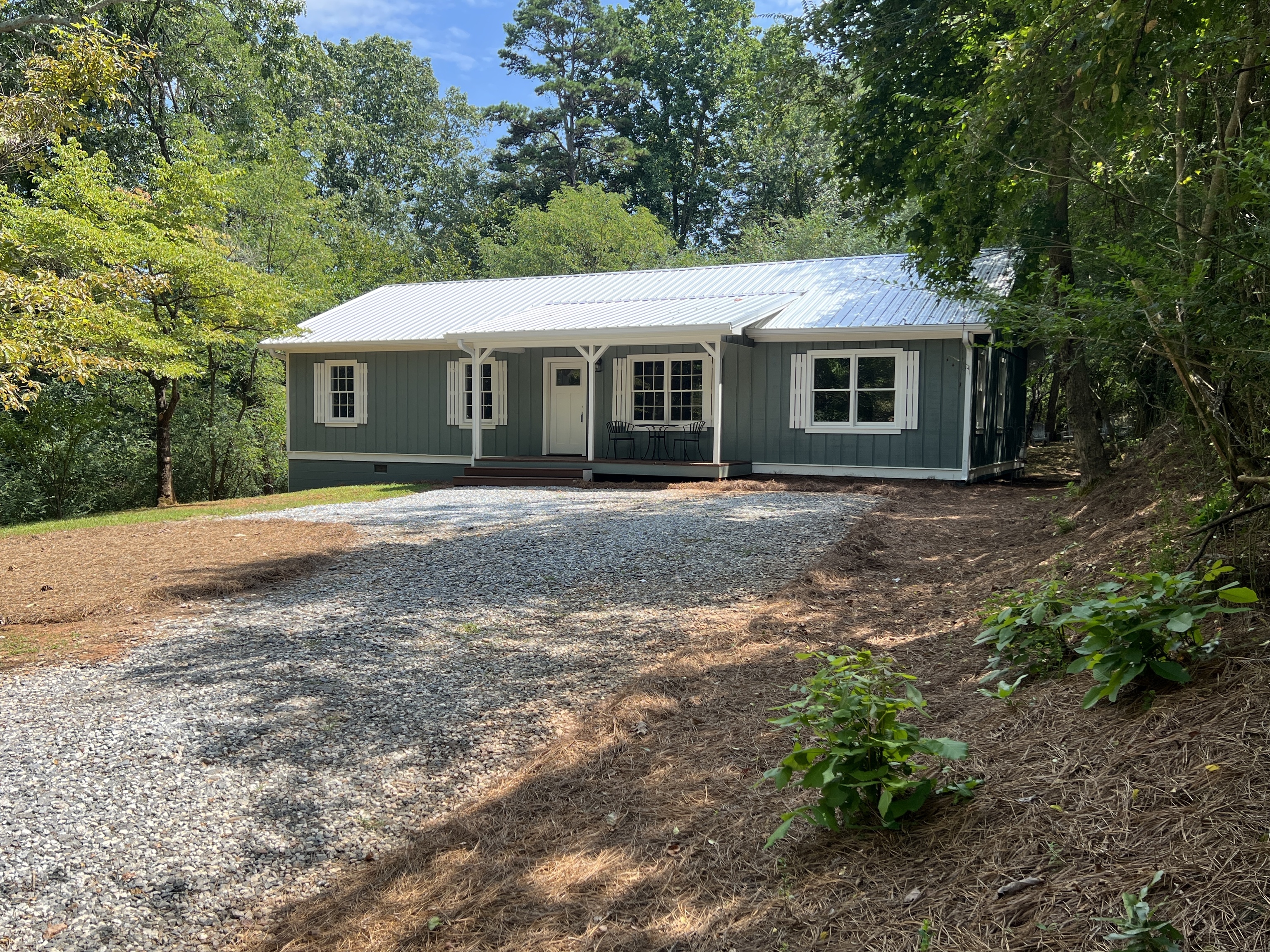 1666 May White Road Cleveland, GA 30528 - Photo 1 of 1 a front view of a house with a garden