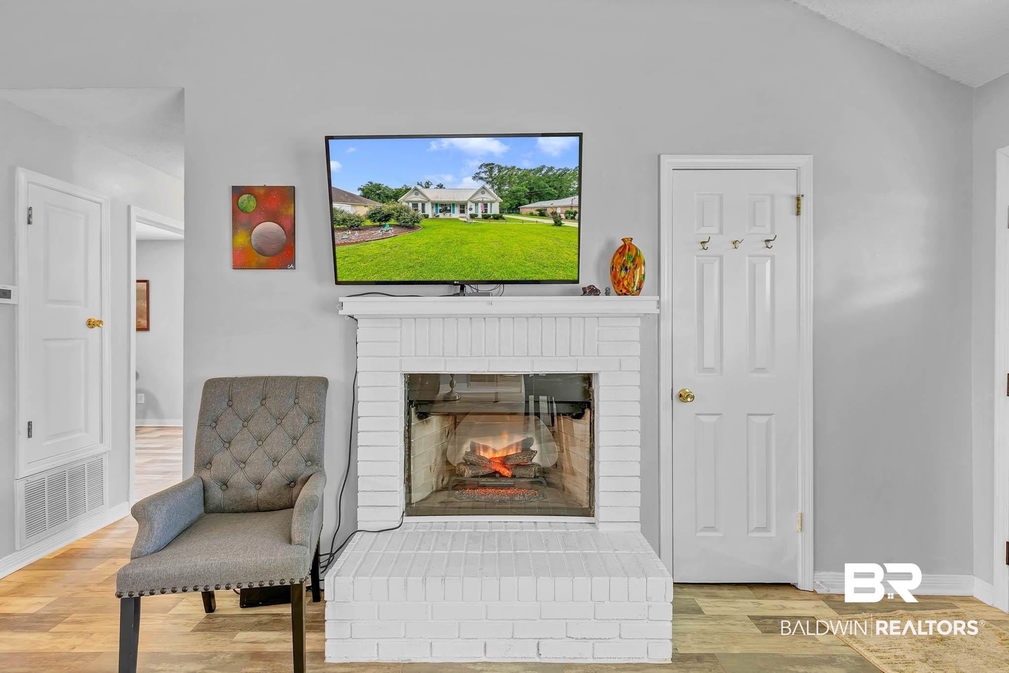 516 Juniper Place Drive Foley, AL 36535 - Photo 6 of 51 Sitting room featuring wood finished floors, a fireplace, and vaulted ceiling