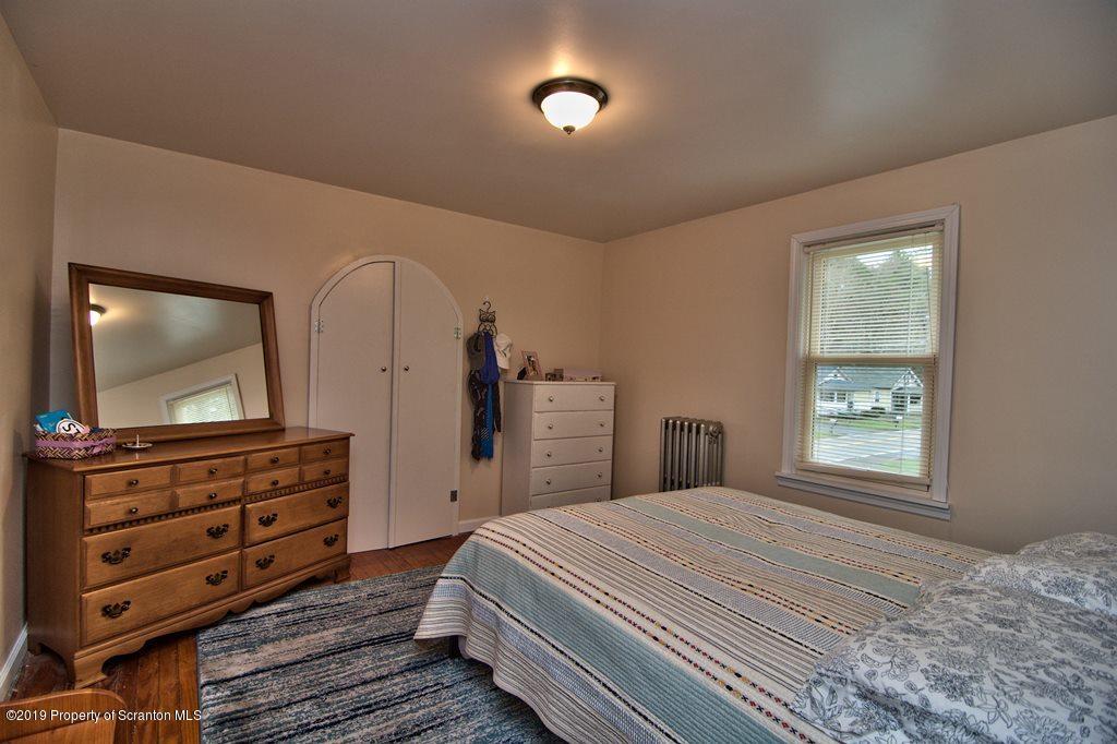 1428 Hillside Road Shavertown, PA 18708 - Photo 13 of 19 a bedroom with a bed and a flat screen tv