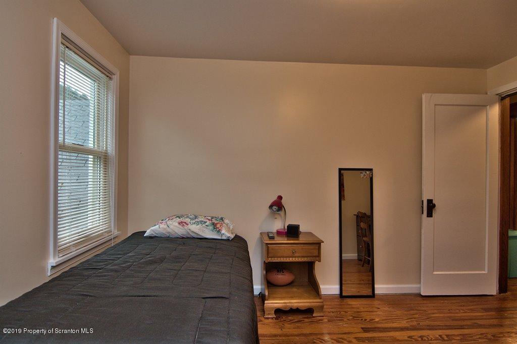 1428 Hillside Road Shavertown, PA 18708 - Photo 16 of 19 a bedroom with a bed and wooden floor