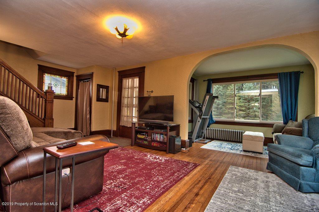 1428 Hillside Road Shavertown, PA 18708 - Photo 4 of 19 a living room with furniture and a flat screen tv