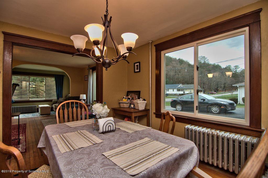 1428 Hillside Road Shavertown, PA 18708 - Photo 8 of 19 a bedroom with a bed and large windows