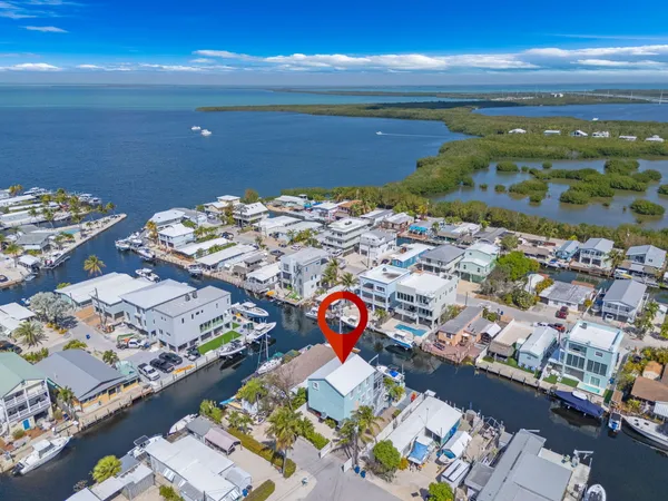 a front view of a house with a yard and a garage