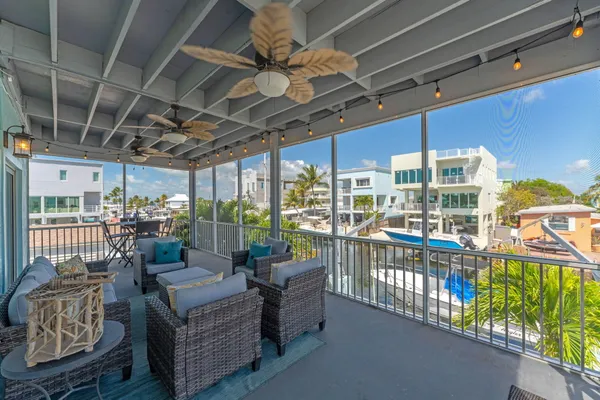 a view of a house with potted plants