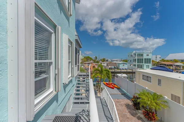 a swimming pool view with a outdoor seating
