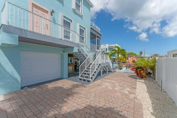 a view of a swimming pool with a lounge chair