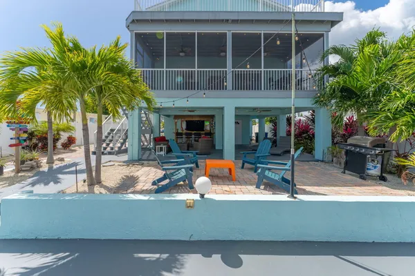 an aerial view of a house with a swimming pool