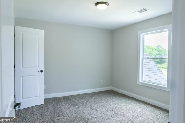 a view of a house with backyard and porch