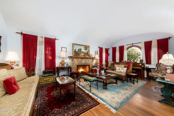 a living room with furniture and a fireplace