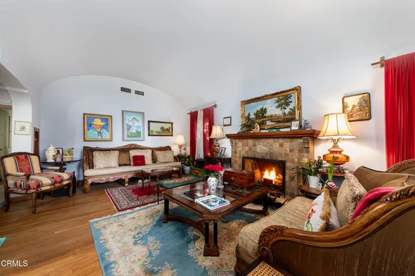 a view of a livingroom with furniture and a window
