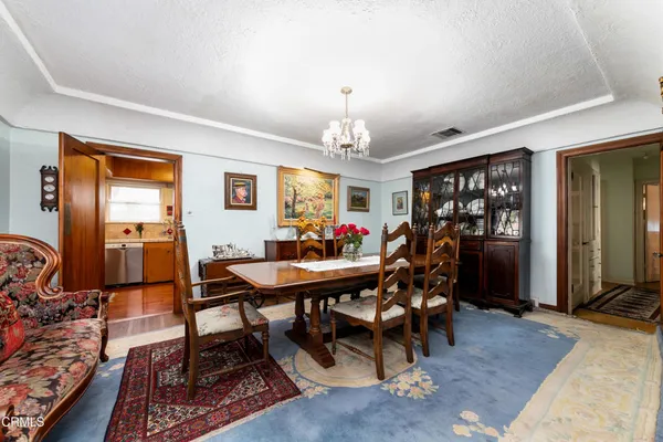a view of a dining room with furniture window and outside view