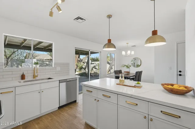 a kitchen with sink and window