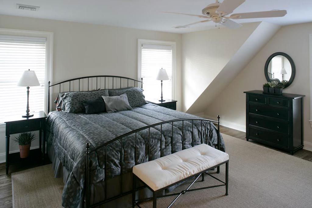 Undisclosed Address Quogue, NY 11959 - Photo 11 of 19 a bedroom with a bed window and a table