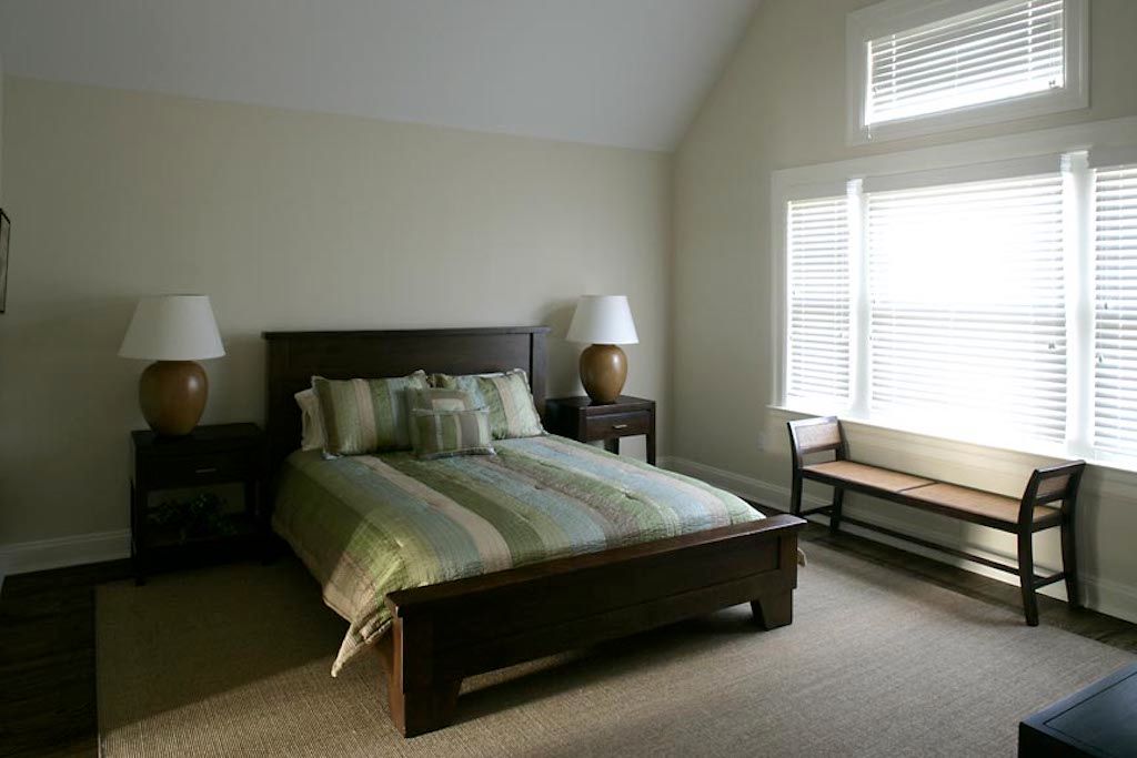 Undisclosed Address Quogue, NY 11959 - Photo 15 of 19 a bedroom with a bed and a window