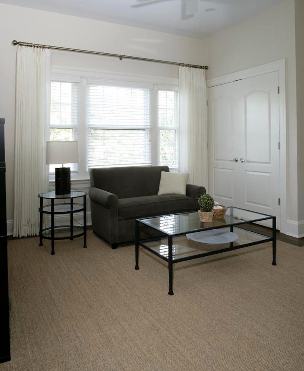 Undisclosed Address Quogue, NY 11959 - Photo 16 of 19 a living room with furniture and a window