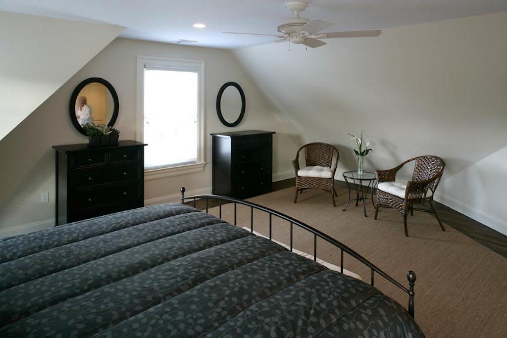 Undisclosed Address Quogue, NY 11959 - Photo 18 of 19 a bedroom with furniture and a mirror