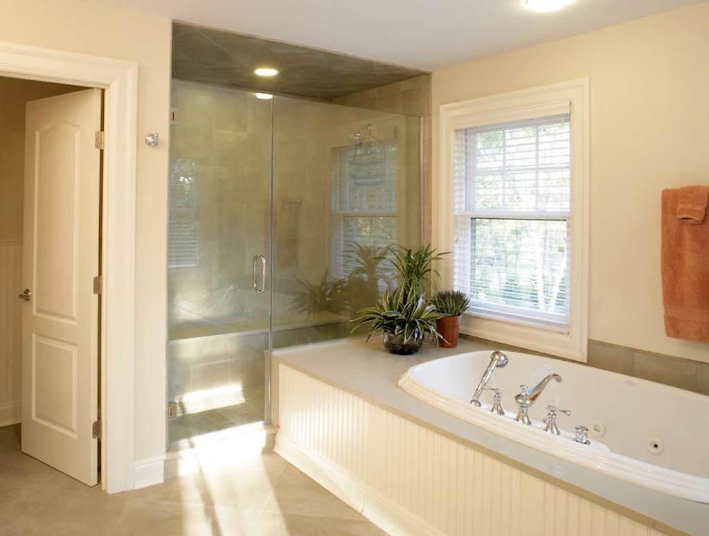Undisclosed Address Quogue, NY 11959 - Photo 8 of 19 a bathroom with a tub a sink and a shower