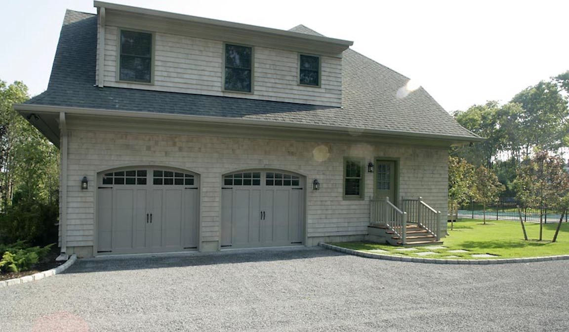Undisclosed Address Quogue, NY 11959 - Photo 10 of 19 a front view of a house with a yard