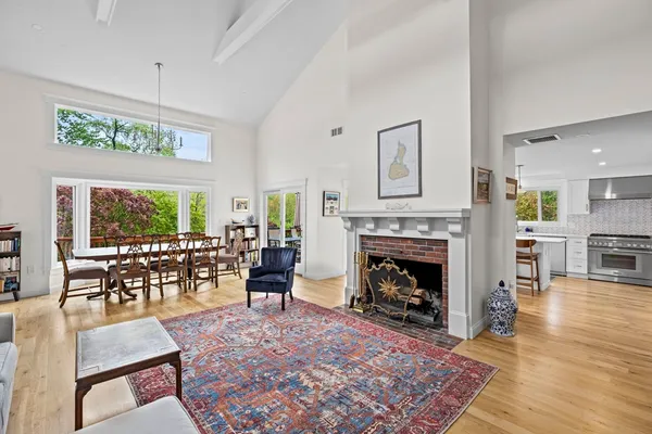 a living room with furniture fireplace and window