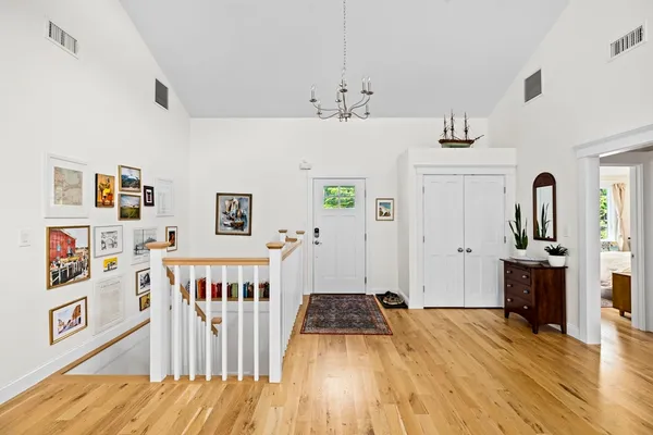 a bedroom with furniture and wooden floor