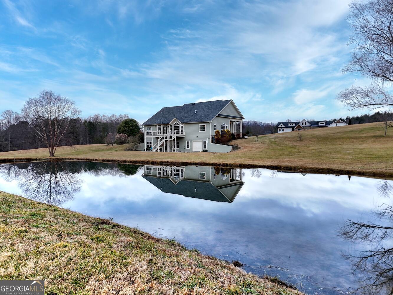 178 Barnwood Road Blairsville, GA 30512 - Photo 12 of 66 a view of a lake with a mountain in the background