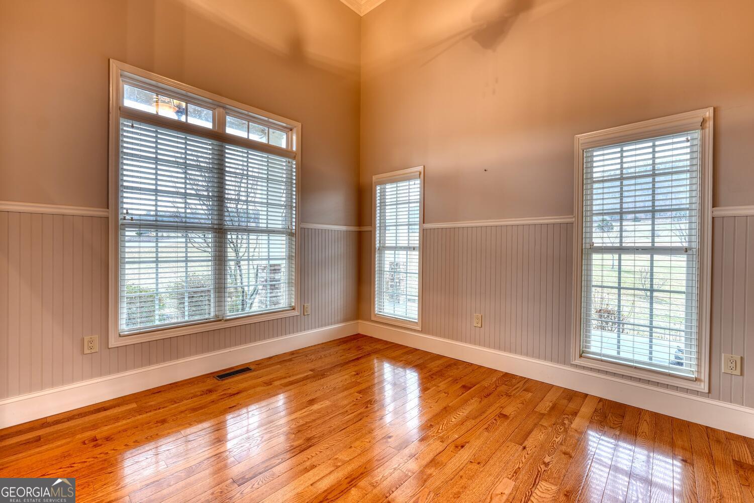 178 Barnwood Road Blairsville, GA 30512 - Photo 17 of 66 a view of an empty room with wooden floor and a window