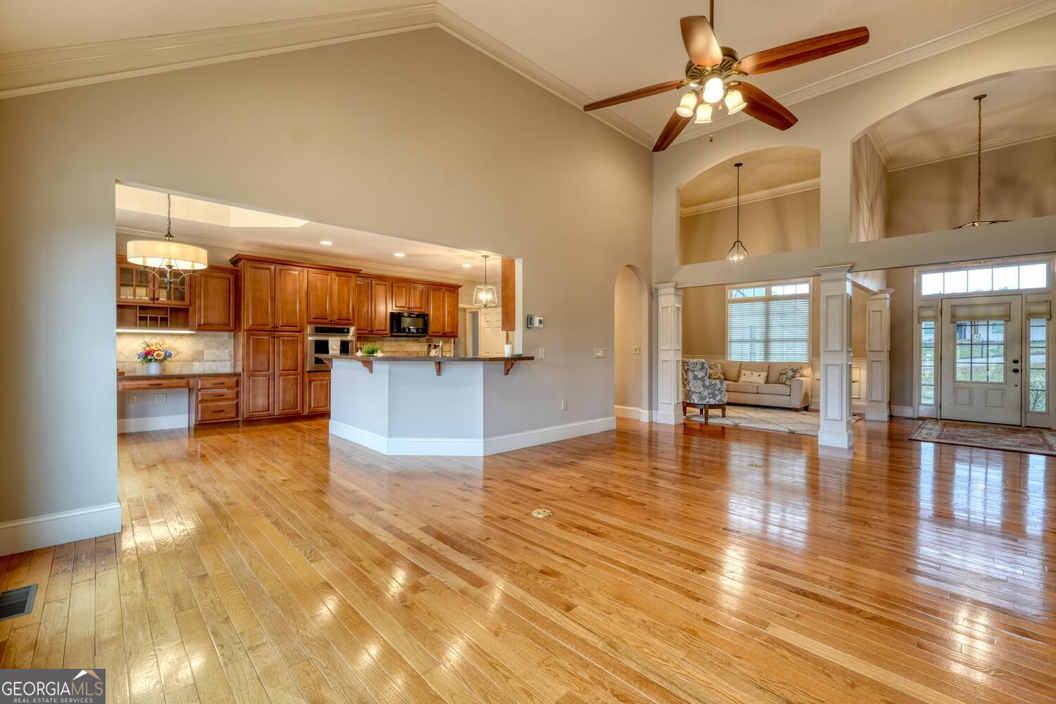 178 Barnwood Road Blairsville, GA 30512 - Photo 23 of 66 a view of a living room kitchen with furniture and wooden floor