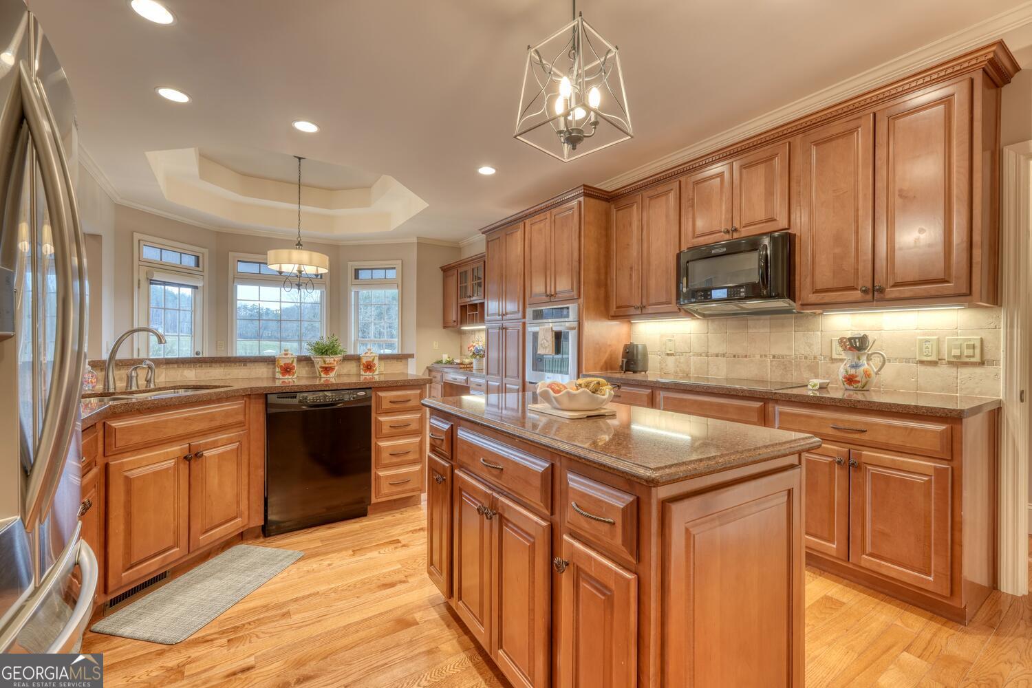 178 Barnwood Road Blairsville, GA 30512 - Photo 28 of 66 a kitchen with stainless steel appliances granite countertop a sink stove and refrigerator