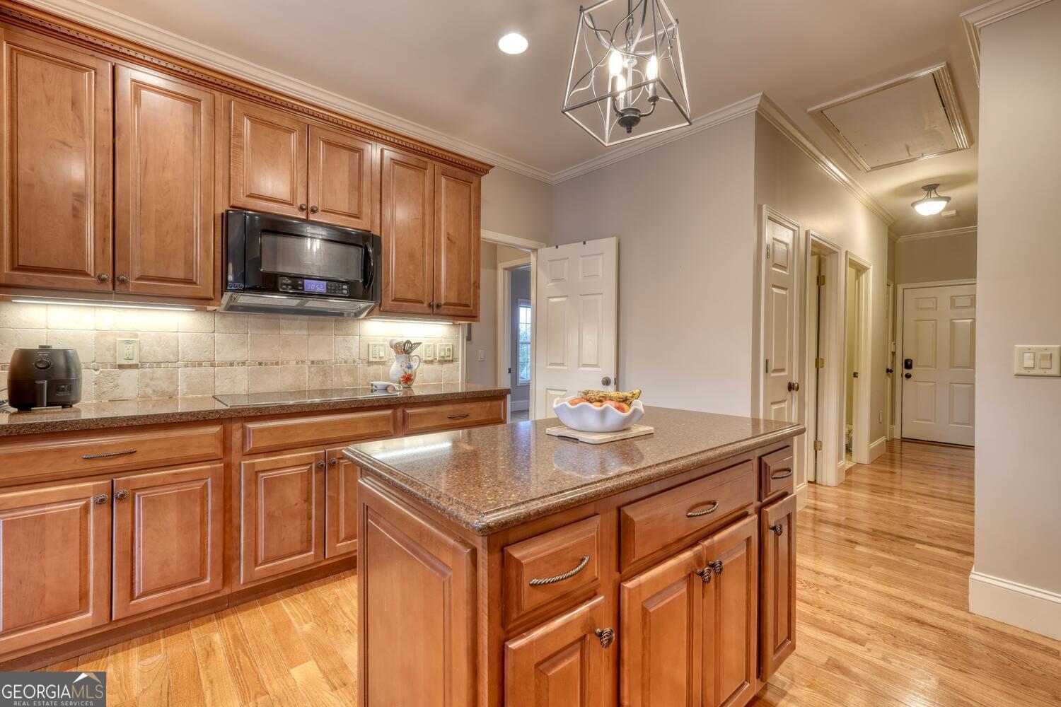 178 Barnwood Road Blairsville, GA 30512 - Photo 29 of 66 a kitchen with stainless steel appliances granite countertop a sink stove and microwave