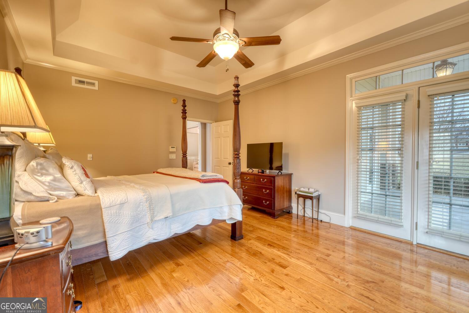 178 Barnwood Road Blairsville, GA 30512 - Photo 33 of 66 a spacious bedroom with a bed and a flat screen tv