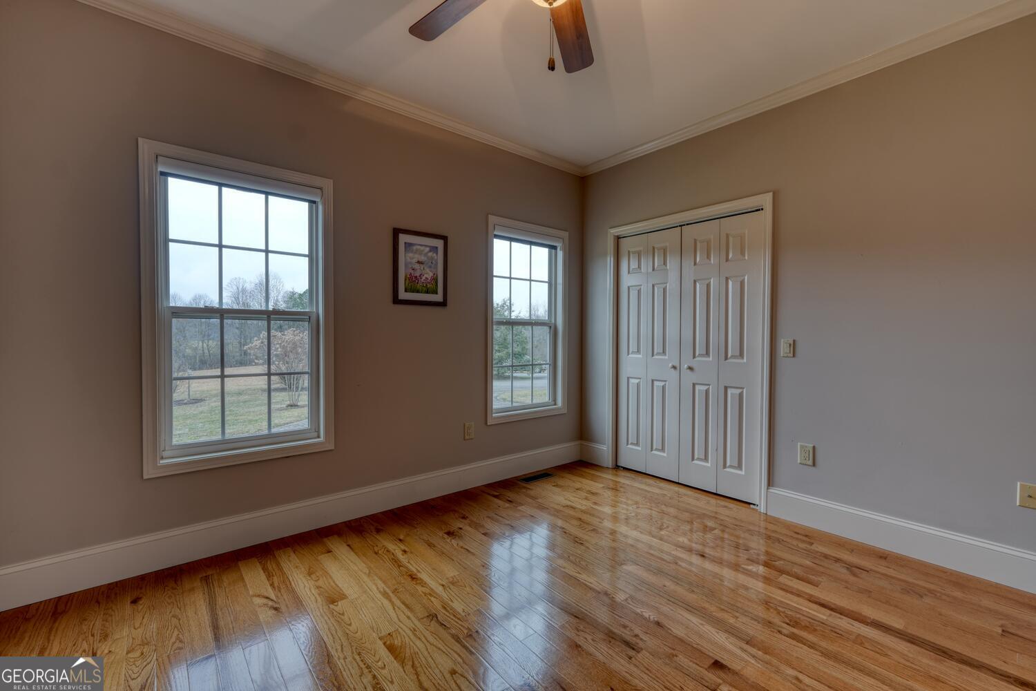 178 Barnwood Road Blairsville, GA 30512 - Photo 37 of 66 a view of an empty room with wooden floor and window