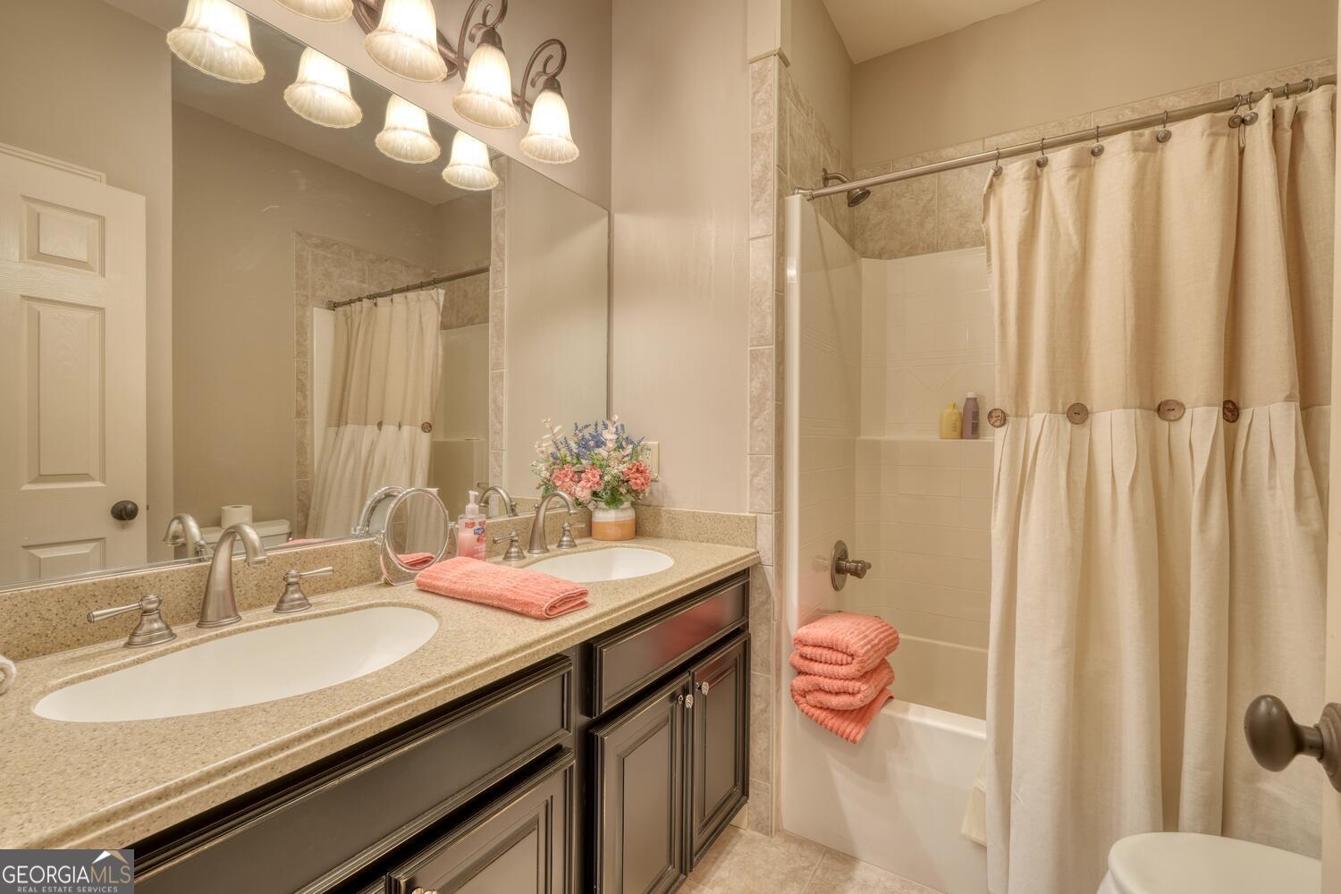 178 Barnwood Road Blairsville, GA 30512 - Photo 39 of 66 a bathroom with a double vanity sink mirror and toilet