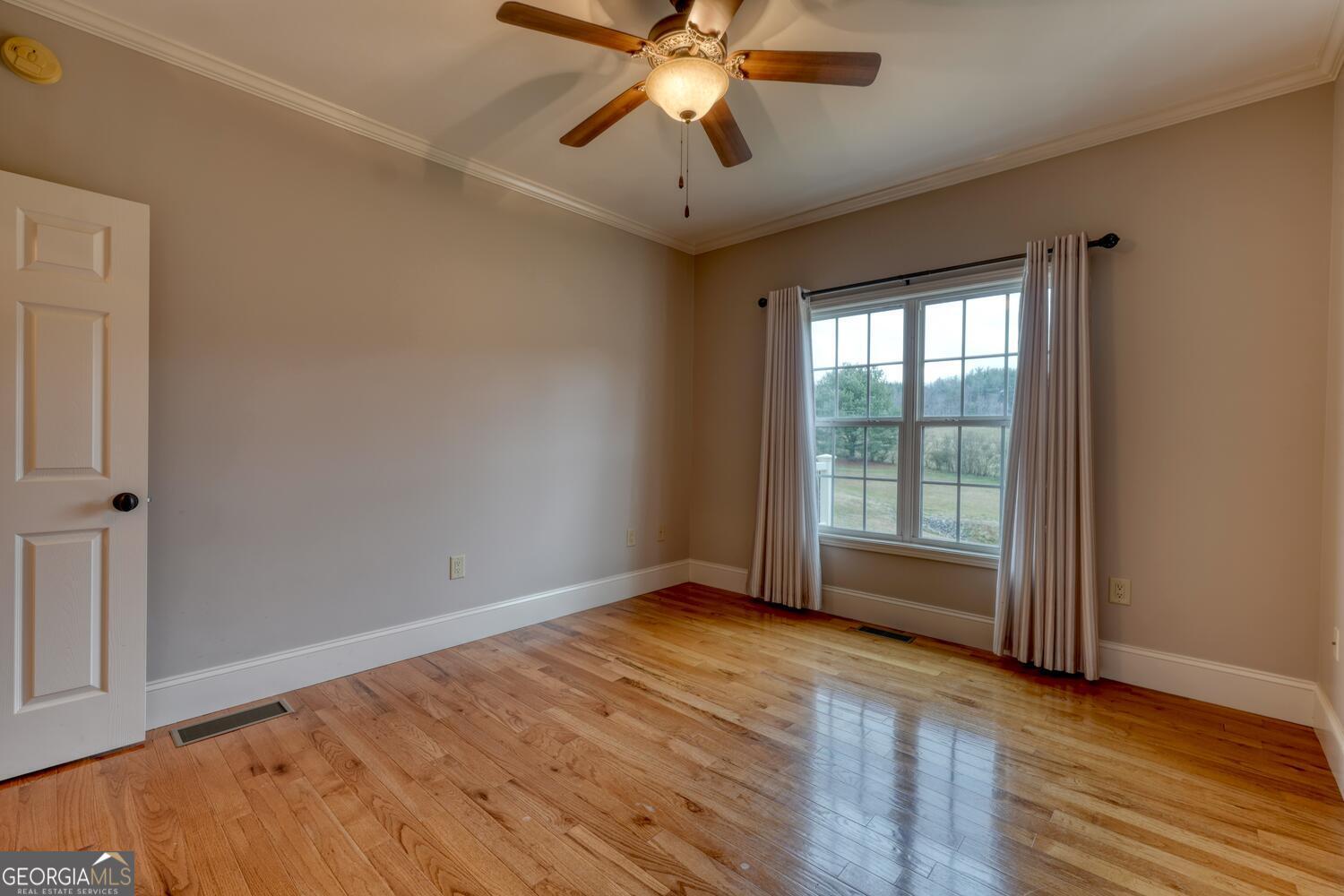 178 Barnwood Road Blairsville, GA 30512 - Photo 40 of 66 a view of an empty room with wooden floor and a window