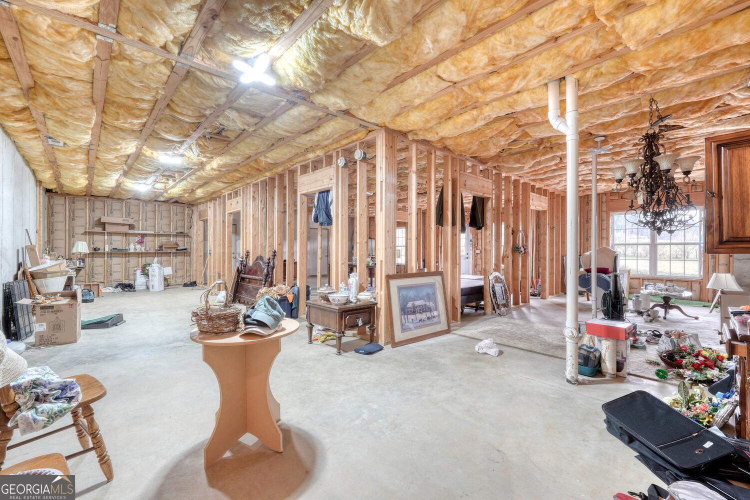 178 Barnwood Road Blairsville, GA 30512 - Photo 45 of 66 a living room with furniture and a chandelier