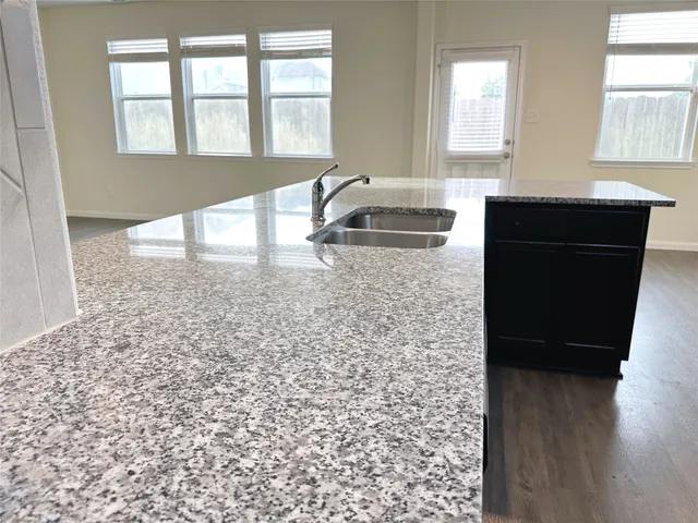 a bathroom with a sink a bathtub and window
