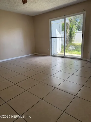 a view of an empty room and a window