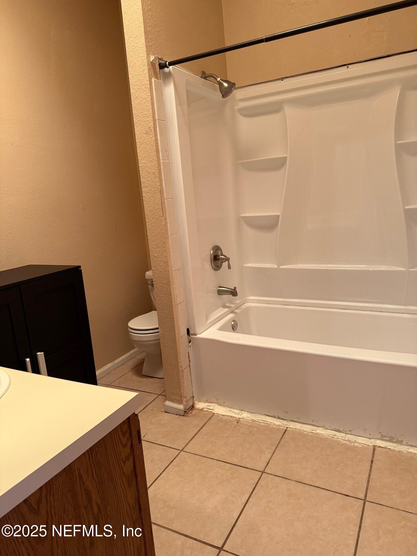 791 Assisi Lane, Unit 803 Jacksonville, FL 32233 - Photo 9 of 15 a bathroom with a shower and a bath tub
