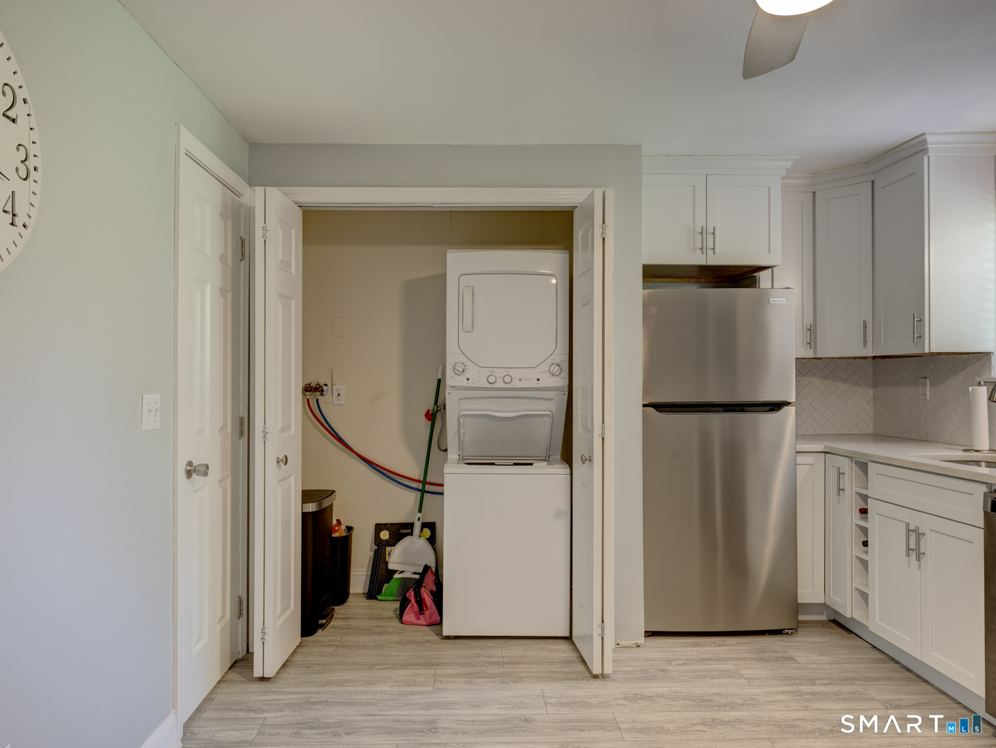2 Branch Road, Unit 2C Thomaston, CT 06787 - Photo 11 of 26 a view of a kitchen from the hallway with a staircase