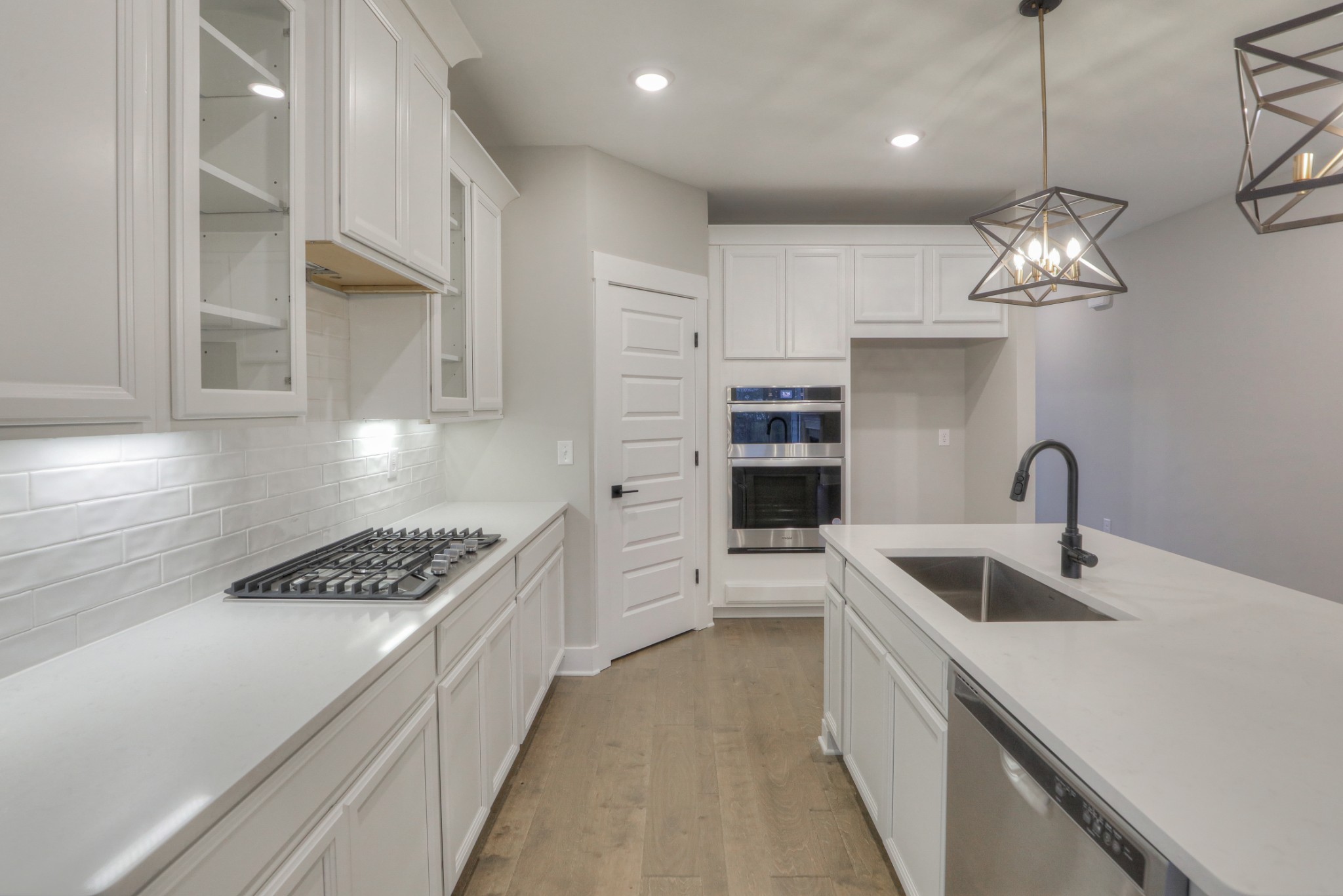 724 Castle Road Mount Juliet, TN 37122 - Photo 12 of 52 a kitchen with stainless steel appliances granite countertop a sink a stove and a refrigerator